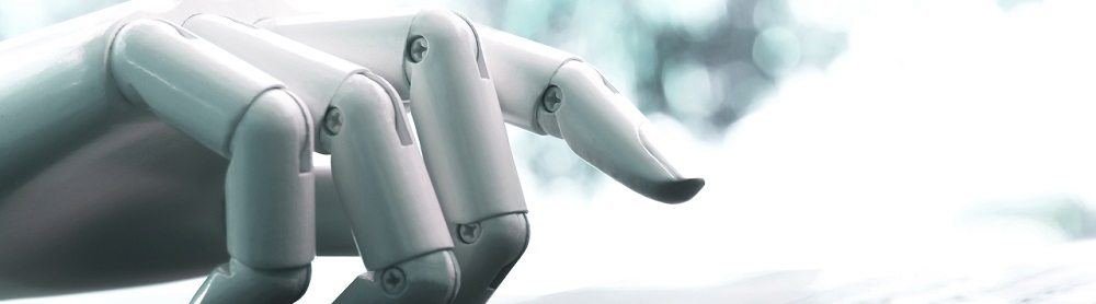 AI robot hand on a computer keyboard