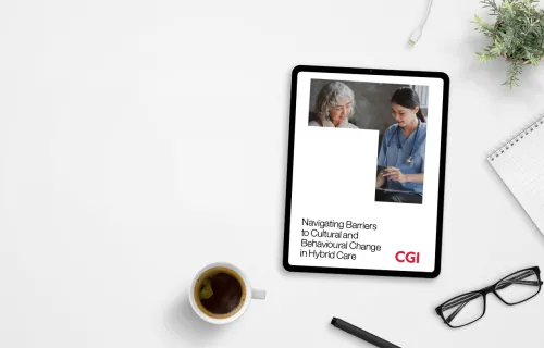 CGI Hybrid care whitepaper displayed on a tablet on busy desk