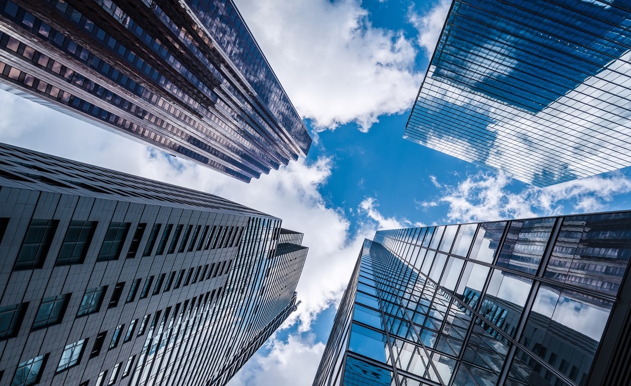 View of the sky between 4 buildings