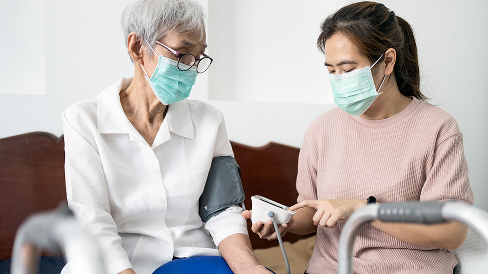 clinician taking a patient's blood pressure