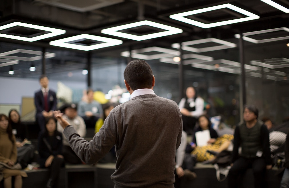 Event - speaker shown facing the crow