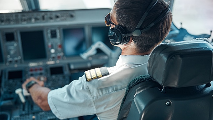 pilot in an airplane cockpit
