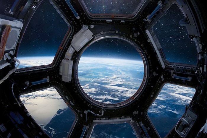 Earth through the International space station porthole.