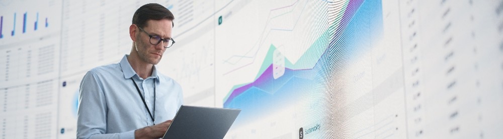 AI consultant looks at data on laptop AI consultant looks at data on laptop