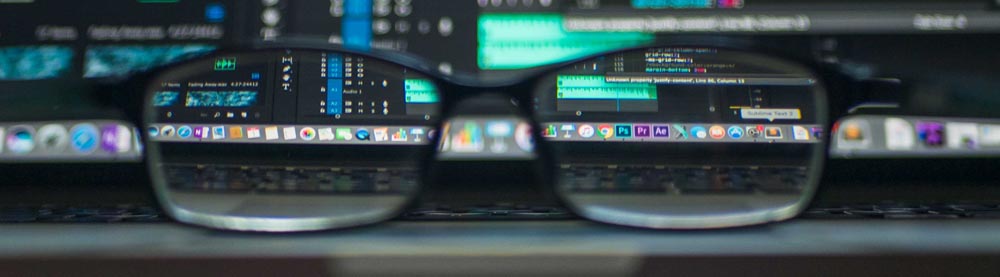 eyeglasses in front of computer screen