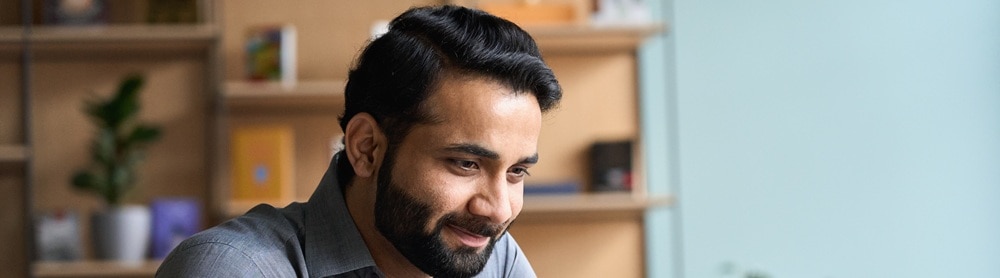 businessman-working-laptop-mobile-422136062 Businessman working on a laptop