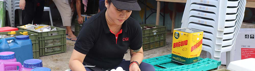 CGI volunteer overseeing food distribution