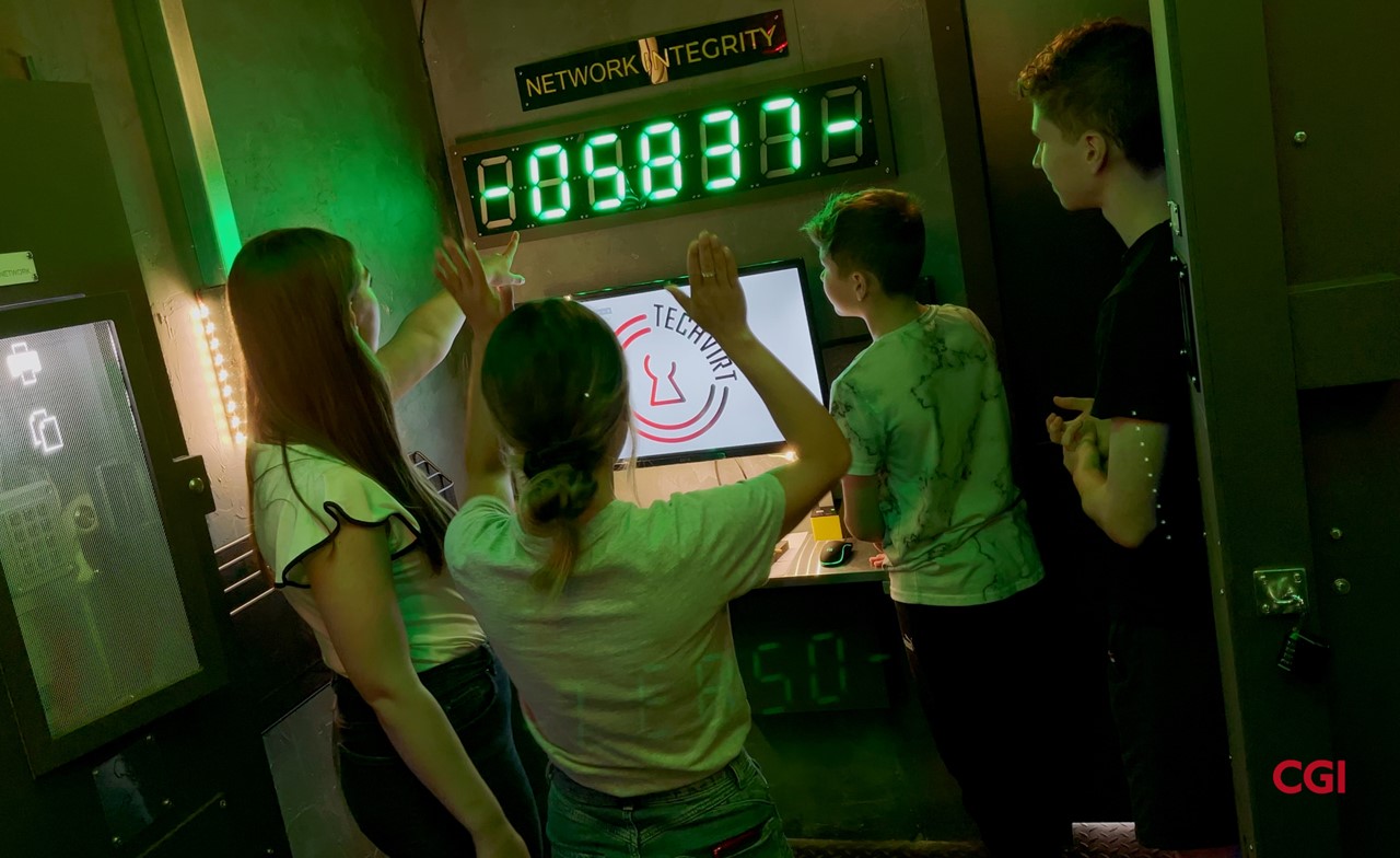 Students interacting with the CGI Cyber Escape