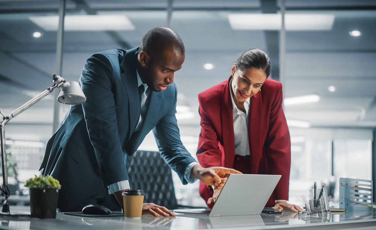 Colleagues looking at a computer