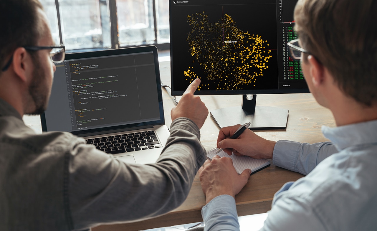 Two data researchers working
