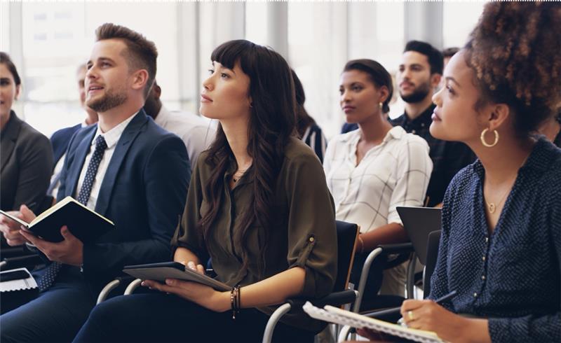 group of people listening at an event