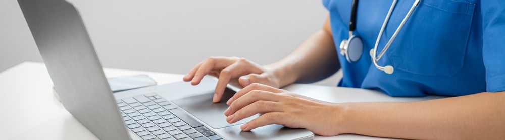Doctor using laptop