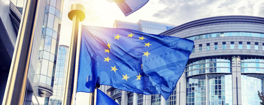 EU flags waving in front of European Parliament building in Brus EU flags waving in front of European Parliament building in Brus