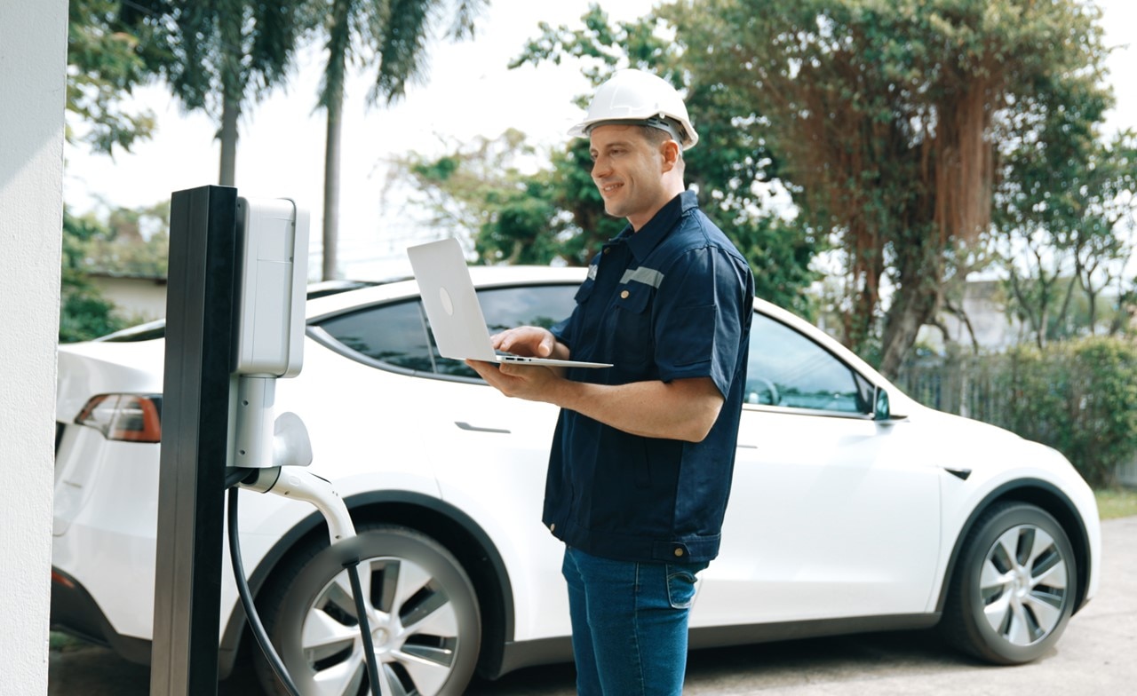 Field worker working on electric vehicle