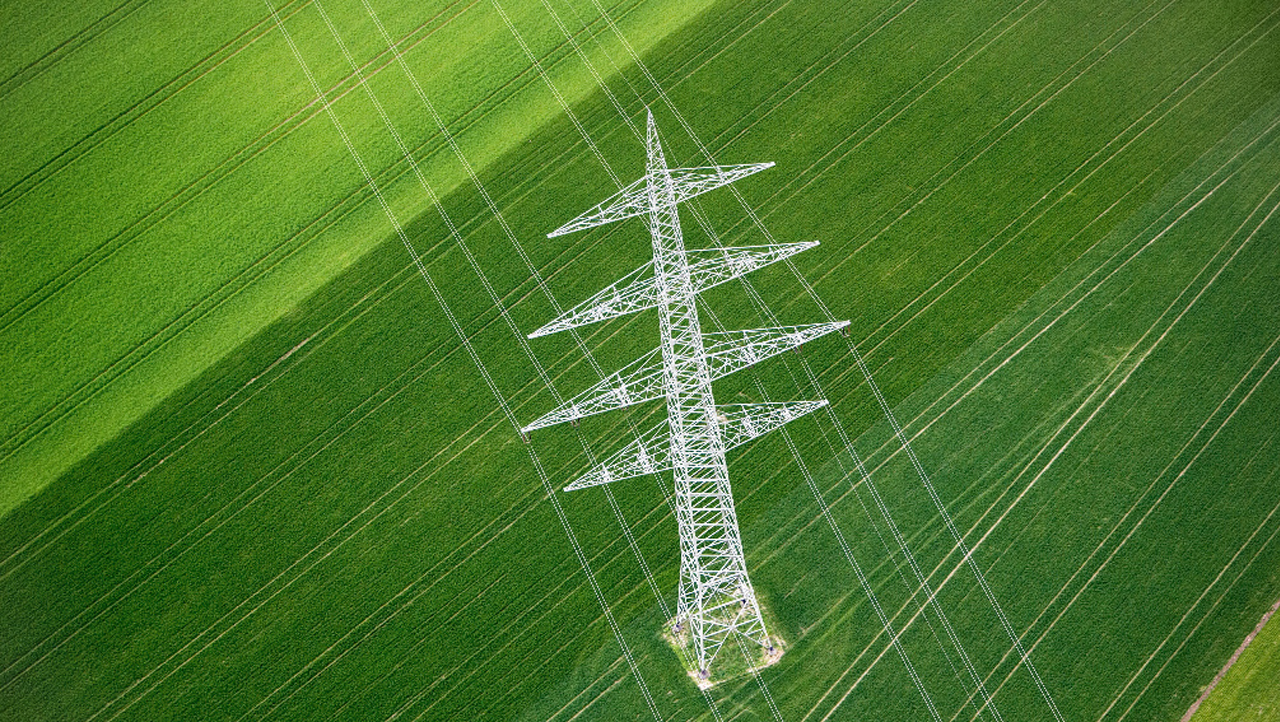 Electric tower inside a farm land