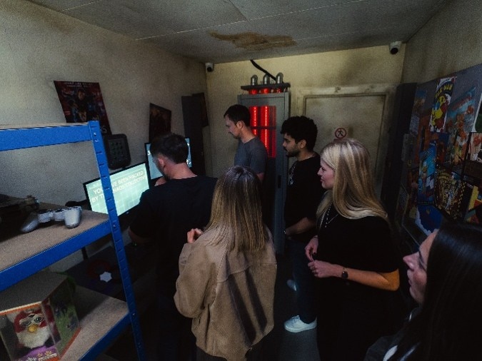 Graduates in the CGI Cyber Escape escape room Graduates in the CGI Cyber Escape escape room