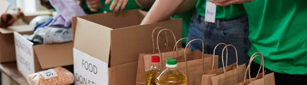 group-sorting-donated-food-383247861-mobile Group of people sorting donated food
