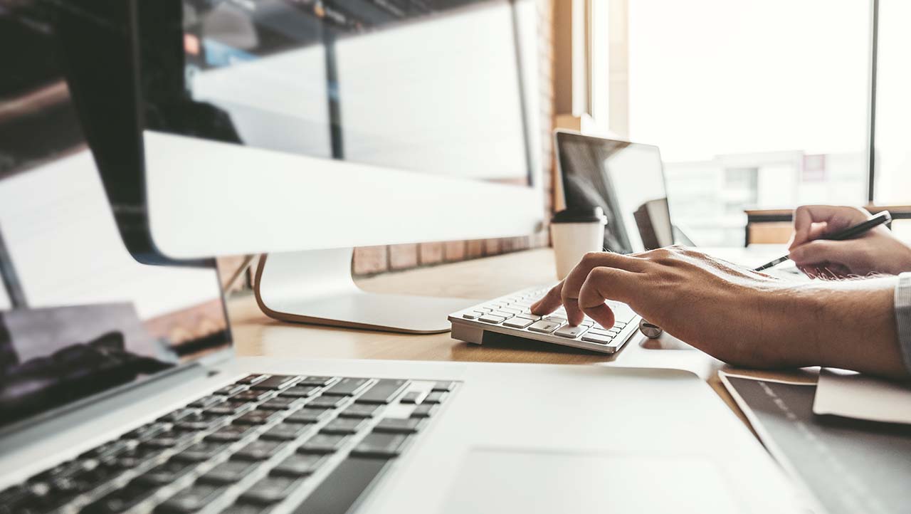 Hand on a computer keyboard