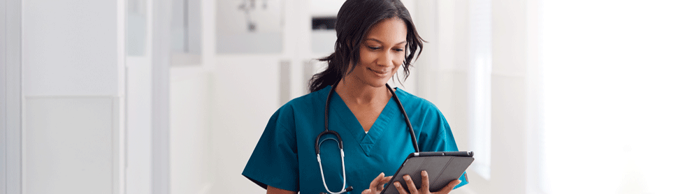 Healthworker holding tablet device