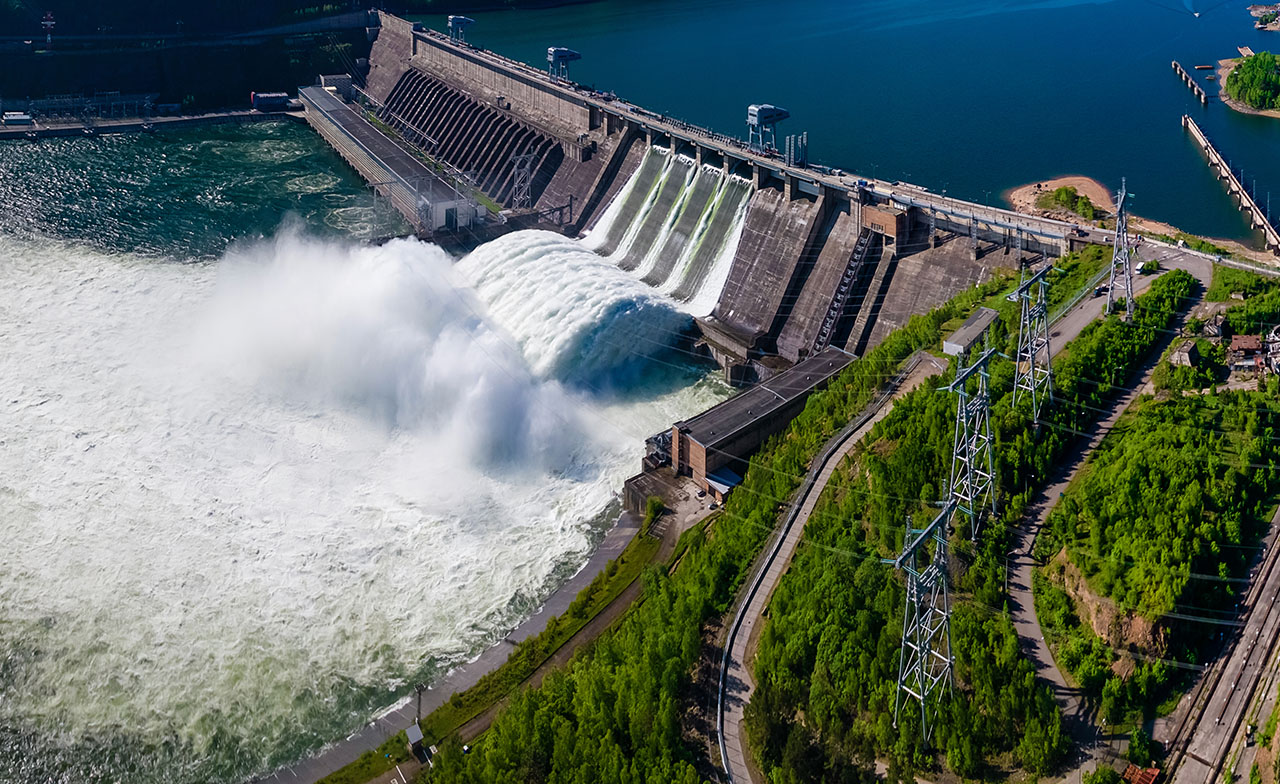 water flowing over a dam