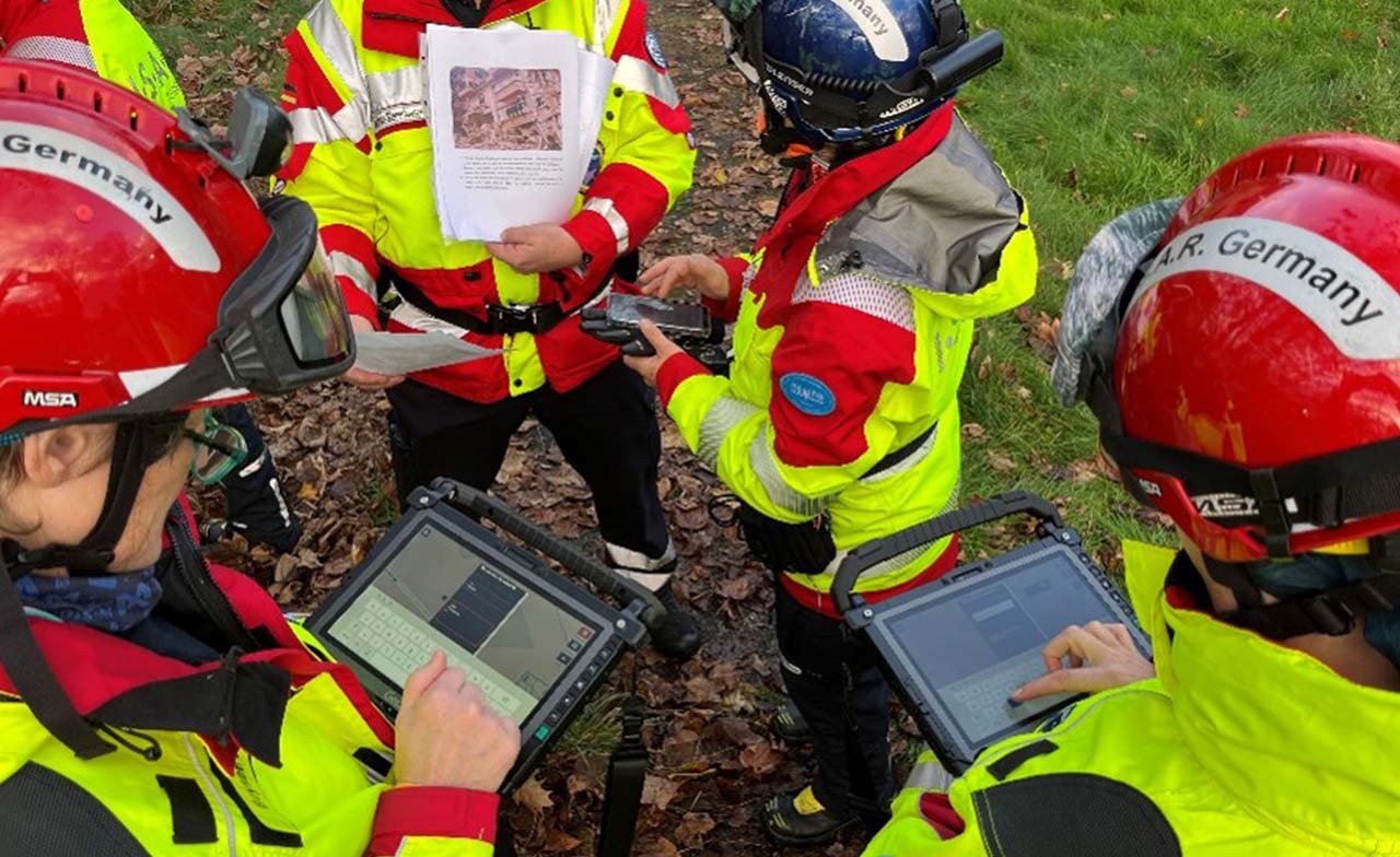 a group of responders using CGI Sense360 to analyze a situation