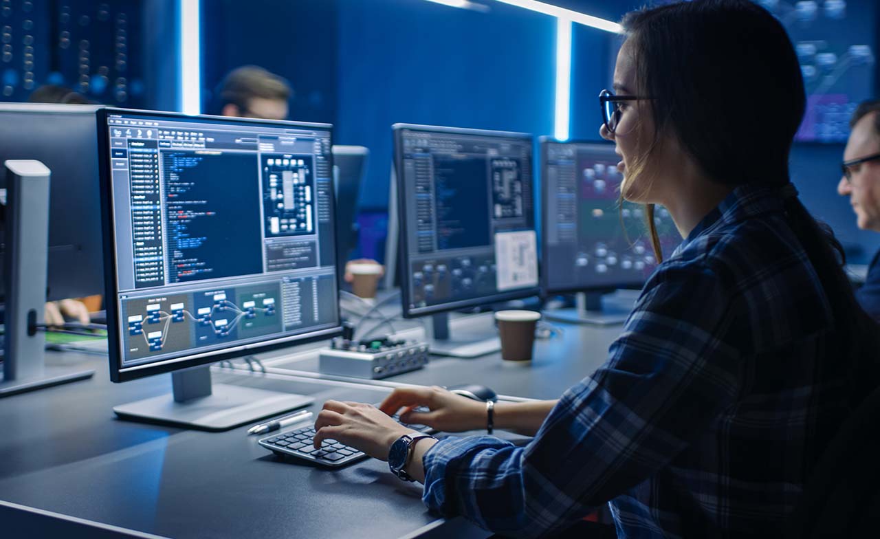 Consultant reviewing data on computer monitor 