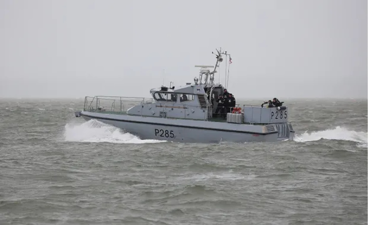 A small gray patrol boat on water