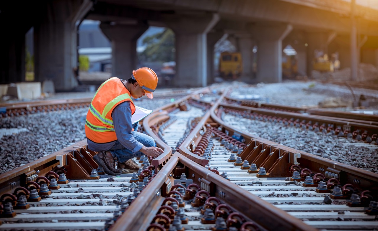 Inspector checking railroad tracks