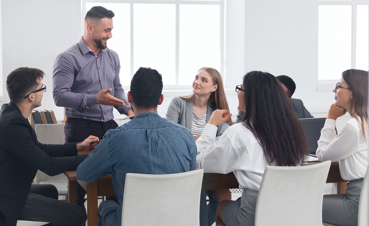 Insurance consultants sat at conference table Insurance consultants sat at conference table