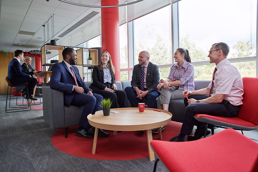lebanon_delivery_center_body_image_3 Group of CGI Partner sitting in common area of an office