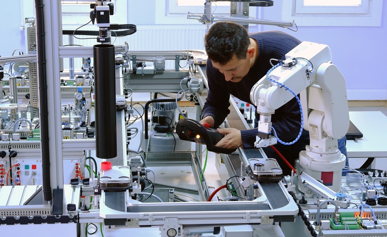 man working with ai robot