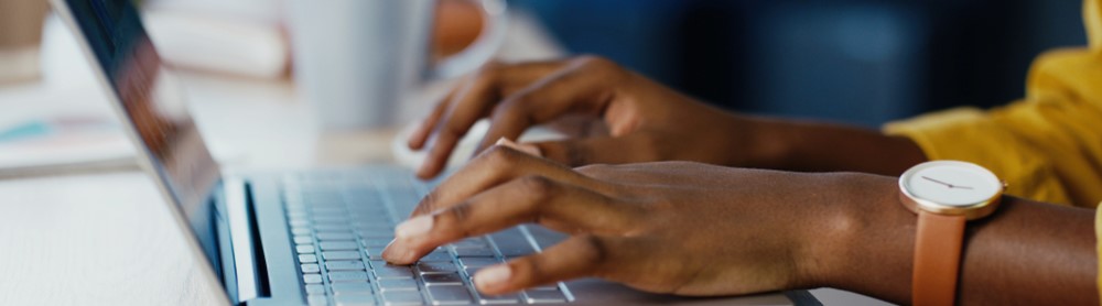 Cloud professional typing on laptop