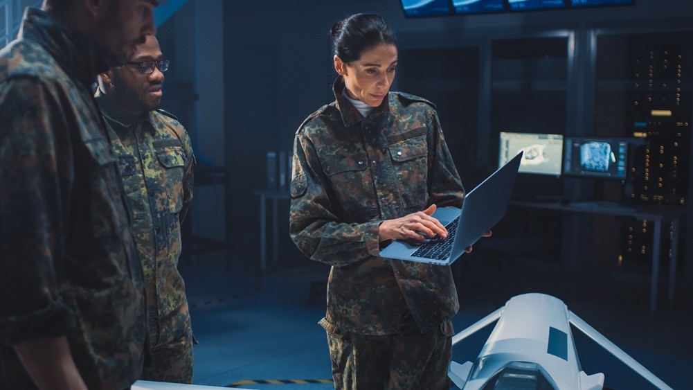 Military personnel meeting in a top secret facility