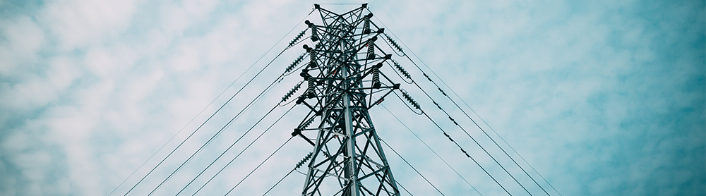 Image showing transmission tower and powerlines with blue sky in background