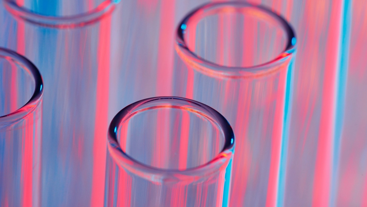 neon blue and red light test tubes in laboratory