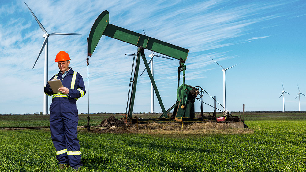 Man with tab - Oil and gas