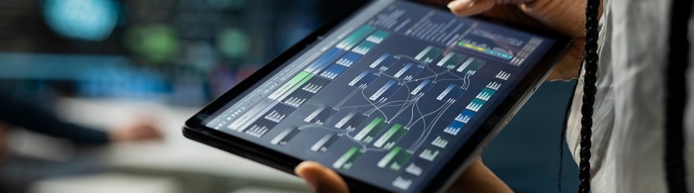 Person reviewing status on a tablet