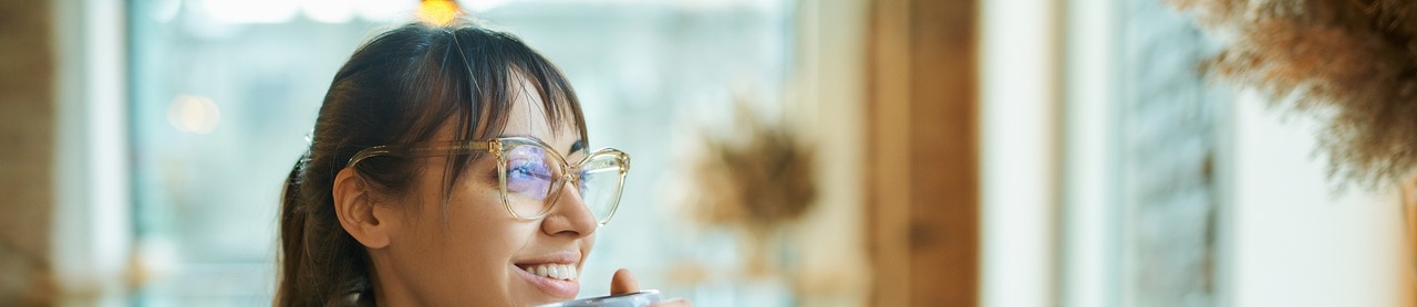 person-smiling-looking-away-334581358 A person smiling and looking away