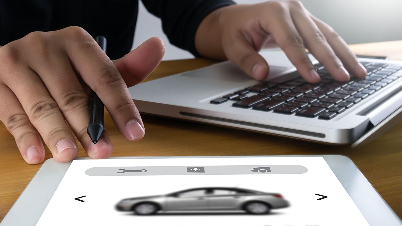 person using laptop and tablet