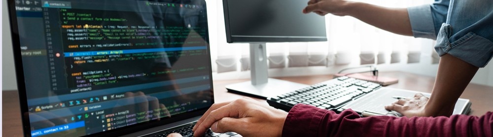 Person pointing to code on a screen