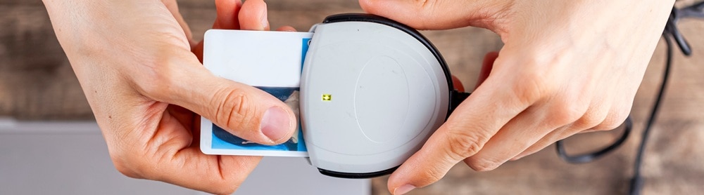 A person using a personal identification card to log onto a computer