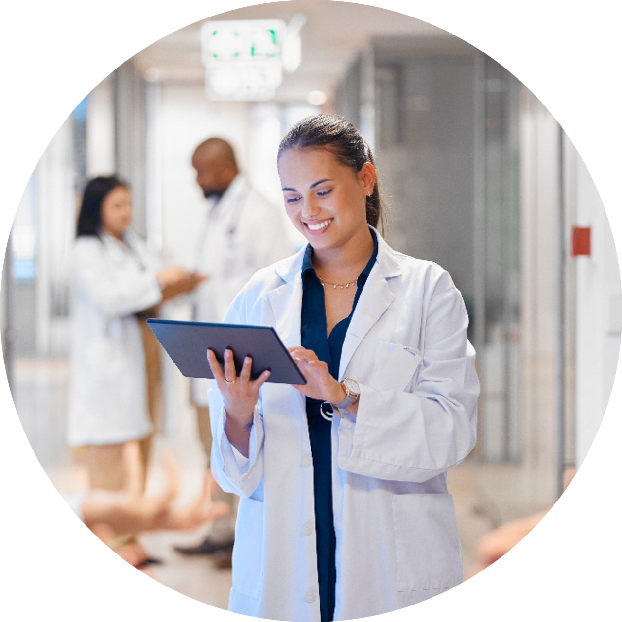 Healthcare_worker_smiling_and_looking_at_ipad