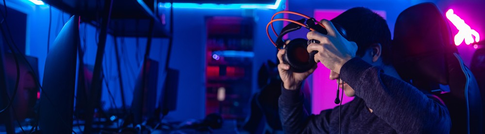 Professional gamer puts gaming headset on