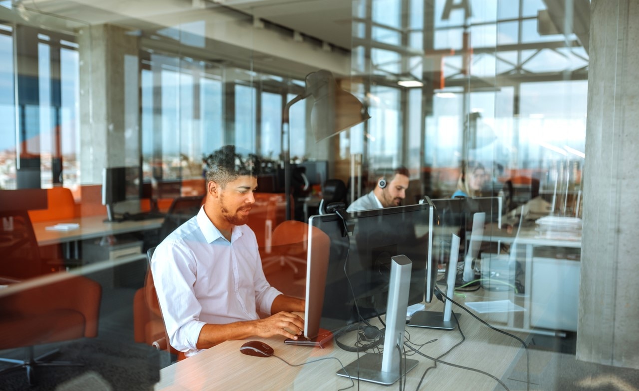 Service desk workers at workstations