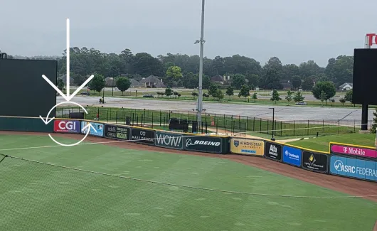 CGI logo in the outfield of the Trash Pandas baseball stadium
