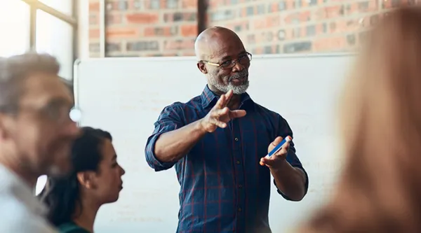 Now there's an idea. Cropped shot of a mature businessman giving a presentation in the…