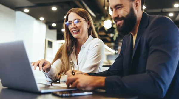 Cheerful businesspeople using ERP