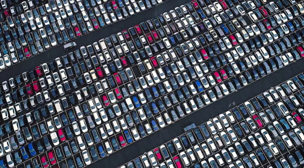 Aerial view of a large parking lot full of cars