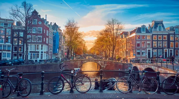 Amsterdam at sunset with houses and bridge