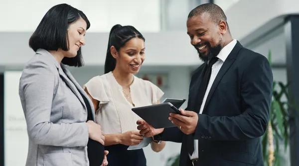 business people talking looking at tablet